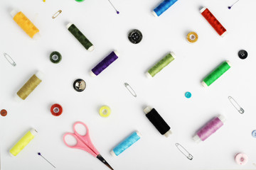 White background with different tools for sewing and tailoring	