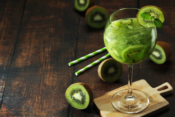 A glass with kiwi cocktail	