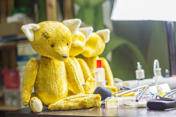 The process of making toys. Toy fox on the table of the master. Needlework