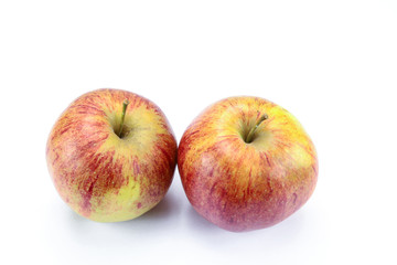 yellow and red apple on a white background
