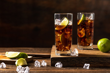 Cuba libre drink on wooden table