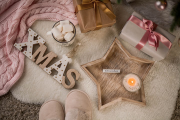 Fototapeta na wymiar Christmas decor. Christmas mood. Christmas tree, gifts, wrapping, ribbons, candle. Cozy. Holidays.