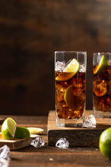 Cuba libre drink on wooden table