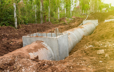 Concrete Drainage Pipe on a Construction Site. Cement tube drainage water from urban.