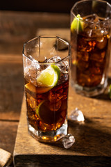 Cuba libre drink on wooden table