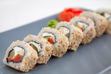 Sushi. Rolls with salmon and sesame
