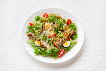salad in a plate on a white background