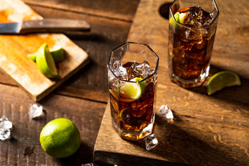 Cuba libre drink on wooden table