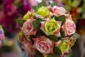 Decoration artificial flower in the pot on table