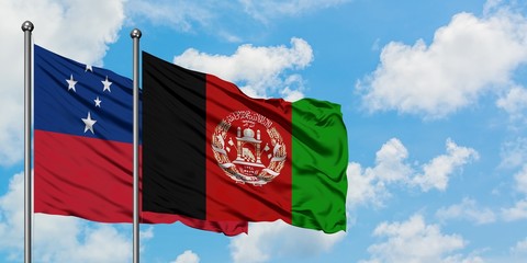Samoa and Afghanistan flag waving in the wind against white cloudy blue sky together. Diplomacy concept, international relations.