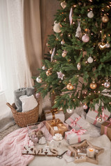Christmas decor. Christmas mood. Christmas tree, gifts, wrapping, ribbons, candle. Cozy. Holidays.