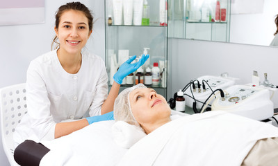 Woman making beauty procedures for face