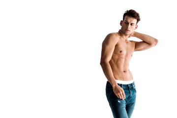 Fototapeta premium sexy man in jeans touching neck isolated on white