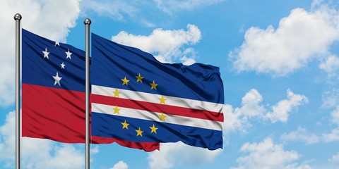 Samoa and Cape Verde flag waving in the wind against white cloudy blue sky together. Diplomacy concept, international relations.