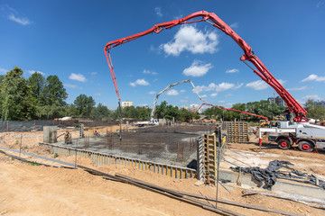 Pouring cement at a house construction site