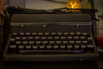 Old-fashinoned typewriter in a dimly it room