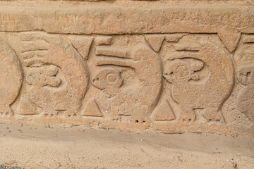  adobe walls and decorations in the archaeological site of Chan Chan made by the Chimu civilization near Trujillo, Peru