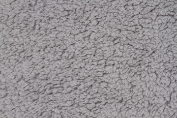Gray sherpa textured plush fabric material background