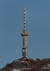 Obraz premium picture of a television tower on a mountain peak