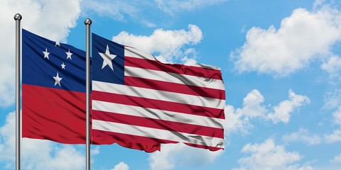 Samoa and Liberia flag waving in the wind against white cloudy blue sky together. Diplomacy concept, international relations.
