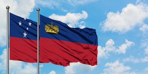 Samoa and Liechtenstein flag waving in the wind against white cloudy blue sky together. Diplomacy concept, international relations.