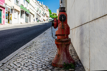 red water column on a city street