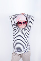 Portrait of a confident girl in sunglasses, a child