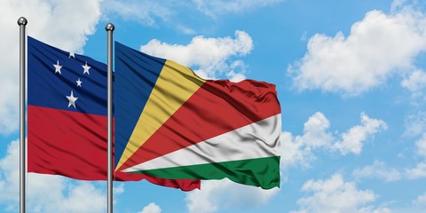 Samoa and Seychelles flag waving in the wind against white cloudy blue sky together. Diplomacy concept, international relations.