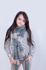 Portrait of a girl with a knitted scarf