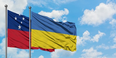 Samoa and Ukraine flag waving in the wind against white cloudy blue sky together. Diplomacy concept, international relations.