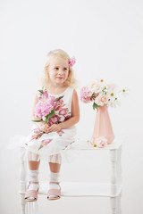 beautiful little blonde girls with  flowers on white background
