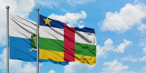 San Marino and Central African Republic flag waving in the wind against white cloudy blue sky together. Diplomacy concept, international relations.