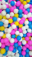 Fototapeta na wymiar Colorful children's balls. Children's pool with balls. Dry basin.