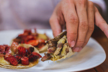 young man with tacos