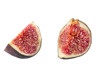 Two slices of purple fig isolated on white background with copy space. Soft, sweet fruit, skin is thin, red flesh has many seeds. Close-up.