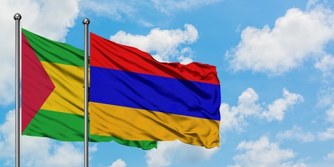 Sao Tome And Principe and Armenia flag waving in the wind against white cloudy blue sky together. Diplomacy concept, international relations.