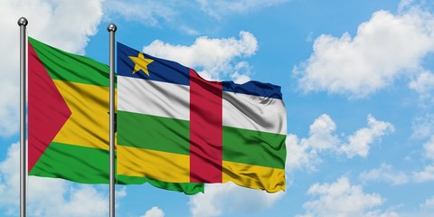 Sao Tome And Principe and Central African Republic flag waving in the wind against white cloudy blue sky together. Diplomacy concept, international relations.