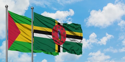 Sao Tome And Principe and Dominica flag waving in the wind against white cloudy blue sky together. Diplomacy concept, international relations.
