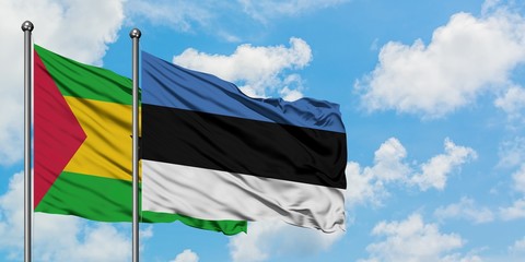 Sao Tome And Principe and Estonia flag waving in the wind against white cloudy blue sky together. Diplomacy concept, international relations.