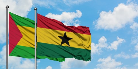 Sao Tome And Principe and Ghana flag waving in the wind against white cloudy blue sky together. Diplomacy concept, international relations.