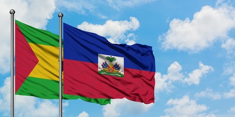 Sao Tome And Principe and Haiti flag waving in the wind against white cloudy blue sky together. Diplomacy concept, international relations.
