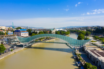 Bridge of Peace in Tbilisi, Geaorgia, bow-shaped pedestrian bridge over the Kura River in Tbilisi, capital of Georgia. One of the most important sites of Tbilisi