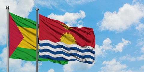 Sao Tome And Principe and Kiribati flag waving in the wind against white cloudy blue sky together. Diplomacy concept, international relations.