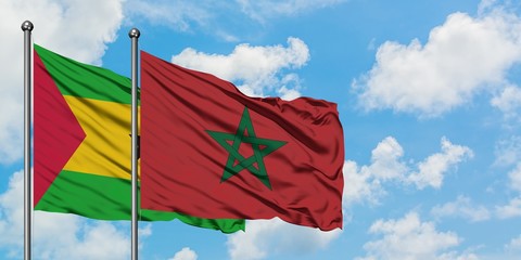 Sao Tome And Principe and Morocco flag waving in the wind against white cloudy blue sky together. Diplomacy concept, international relations.