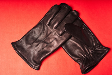 Black Winter Leather Gloves for Men on red background