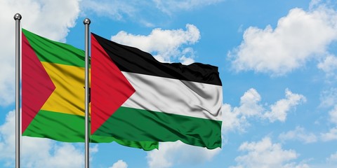 Sao Tome And Principe and Palestine flag waving in the wind against white cloudy blue sky together. Diplomacy concept, international relations.