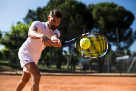 Tennis player during a tennis match, focus on tennis ball