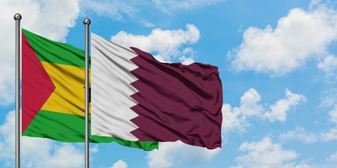 Sao Tome And Principe and Qatar flag waving in the wind against white cloudy blue sky together. Diplomacy concept, international relations.