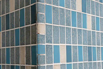 mosaic tiles of the facade of a mid century modern office building