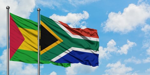 Sao Tome And Principe and South Africa flag waving in the wind against white cloudy blue sky together. Diplomacy concept, international relations.